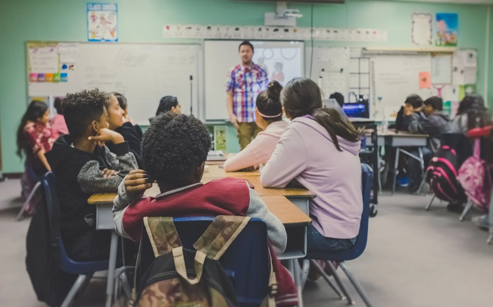 A teacher addressing a classroom of students